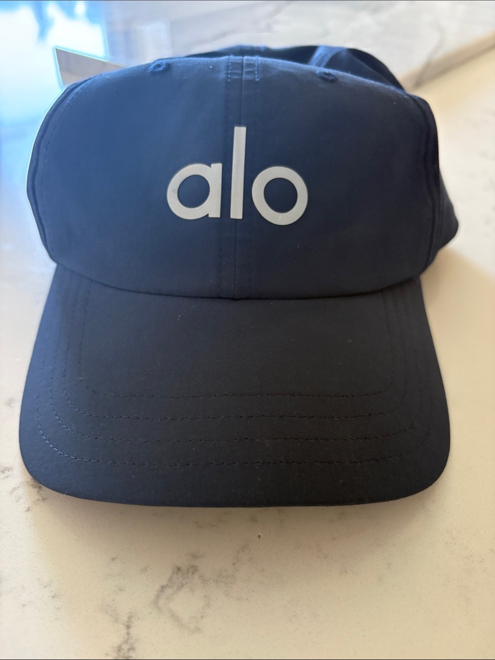 ALO Yoga Womens baseball cap Navy with White/grey Logo. Like new